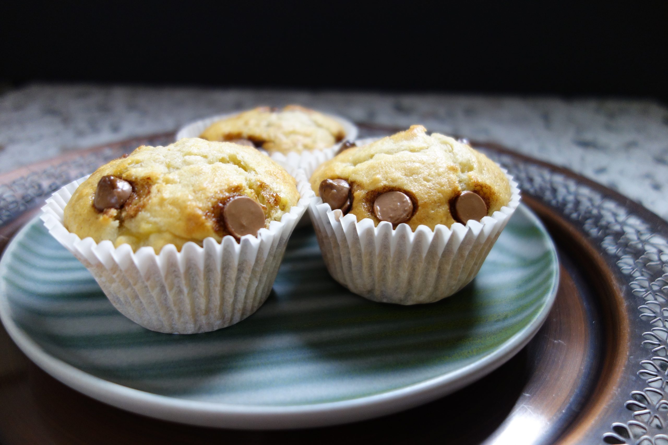 Banana Muffins With Chocolate Chips on a green plate