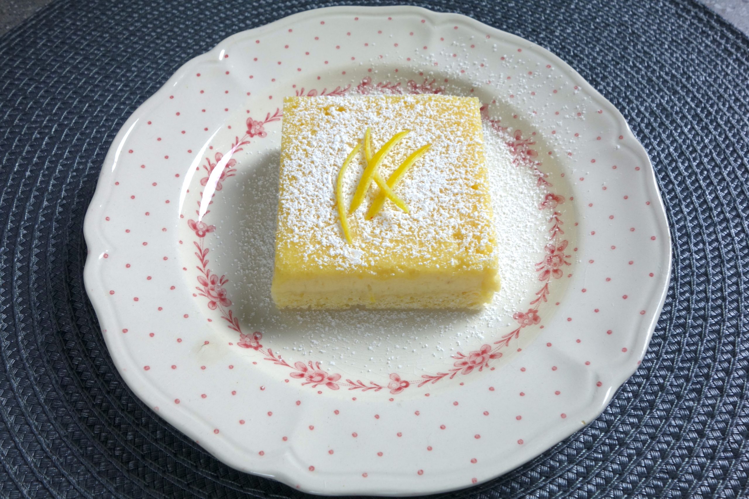 lemon and almond slice on a floral pattern plate