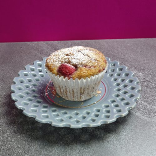 raspberry muffin on a blue plate
